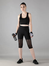 Waylene Women's Black Track Suit with Capri Tights, front view with water bottle