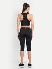Back view of Waylene's black sports bra and Capri tracksuit set. Model shows off the racerback sports bra and high-waisted Capri that enhances the body's natural silhouette, perfect for athletic activities.