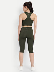 Rear view of Waylene's olive green capri tights and sports bra on a model, showing the back design and logo placement on the sports bra.