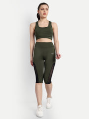 Model standing front facing in Waylene's olive green capri tights and matching sports bra, designed for yoga and gym, highlighting the smooth fabric and comfortable fit.