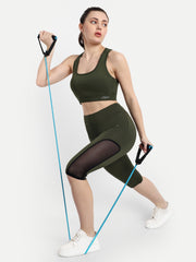 Waylene's olive green women's tracksuit and capri tights for yoga and gym, featuring a model using resistance bands in a dynamic pose to showcase flexibility and fit.
