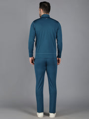 Rear view of Waylene's teal slimfit training set, showing the back of the sweatshirt and trackpants on a model