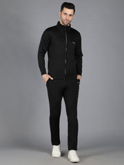 Waylene's black slimfit training set modeled by a male standing straight and looking directly at the camera. This front view shows the cohesive and stylish design of the sweatshirt and trackpants.