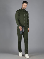 Waylene's athletic wear featuring a male model in olive green, full-zip slimfit sweatshirt and matching track pants, showcasing the front view with hands lightly touching the zipper, on a grey backdrop.