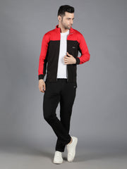 Waylene's red and black slimfit training tracksuit for men, featuring a model in a relaxed pose with a hand in pocket, wearing a red and black zip-up jacket and black pants, paired with white sneakers.