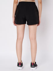 Rear view of Waylene's black polyester shorts on a female model, displaying the relaxed fit and elastic waist, suitable for various sports and casual activities.