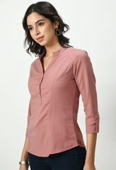 Waylene Soft Pink Tailored Shirt for Women showcasing a band collar, buttoned placket, and tailored seams for a flattering fit.