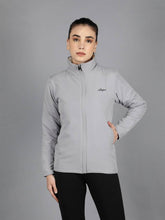 Waylene's women's grey waterproof jacket featuring a high collar, front zipper, and a confident model posing with her hand on her hip.