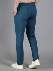 Back view of Waylene's teal blue solid trackpant on a male model, highlighting the smooth and clean silhouette.