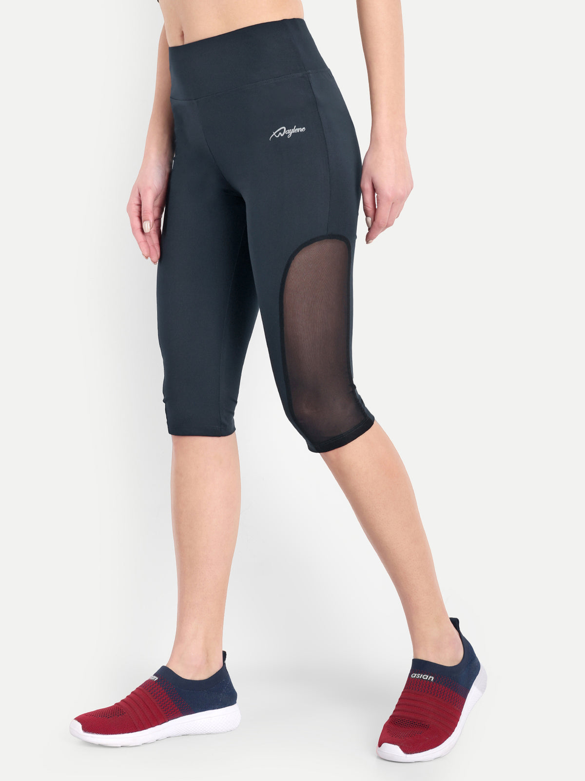 Woman posing in Waylene navy blue high-waisted sports capris with mesh panels side view