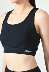 Fitness model showcasing the comfortable fit and support of Waylene's black sports bra close view