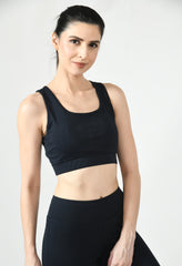 Fitness model showcasing the comfortable fit and support of Waylene's black sports bra front view