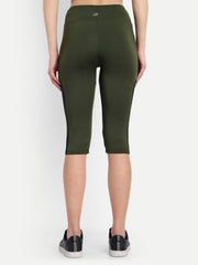 Woman in Waylene olive green high-waisted sports capris with mesh panels back view