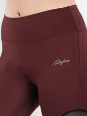 Woman in Waylene maroon (wine) high-waisted sports capris with mesh panels fabric view