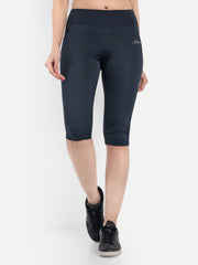 Woman wearing Waylene navy blue high-waisted plain sports capris front view