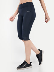 Woman wearing Waylene navy blue high-waisted plain sports capris side view