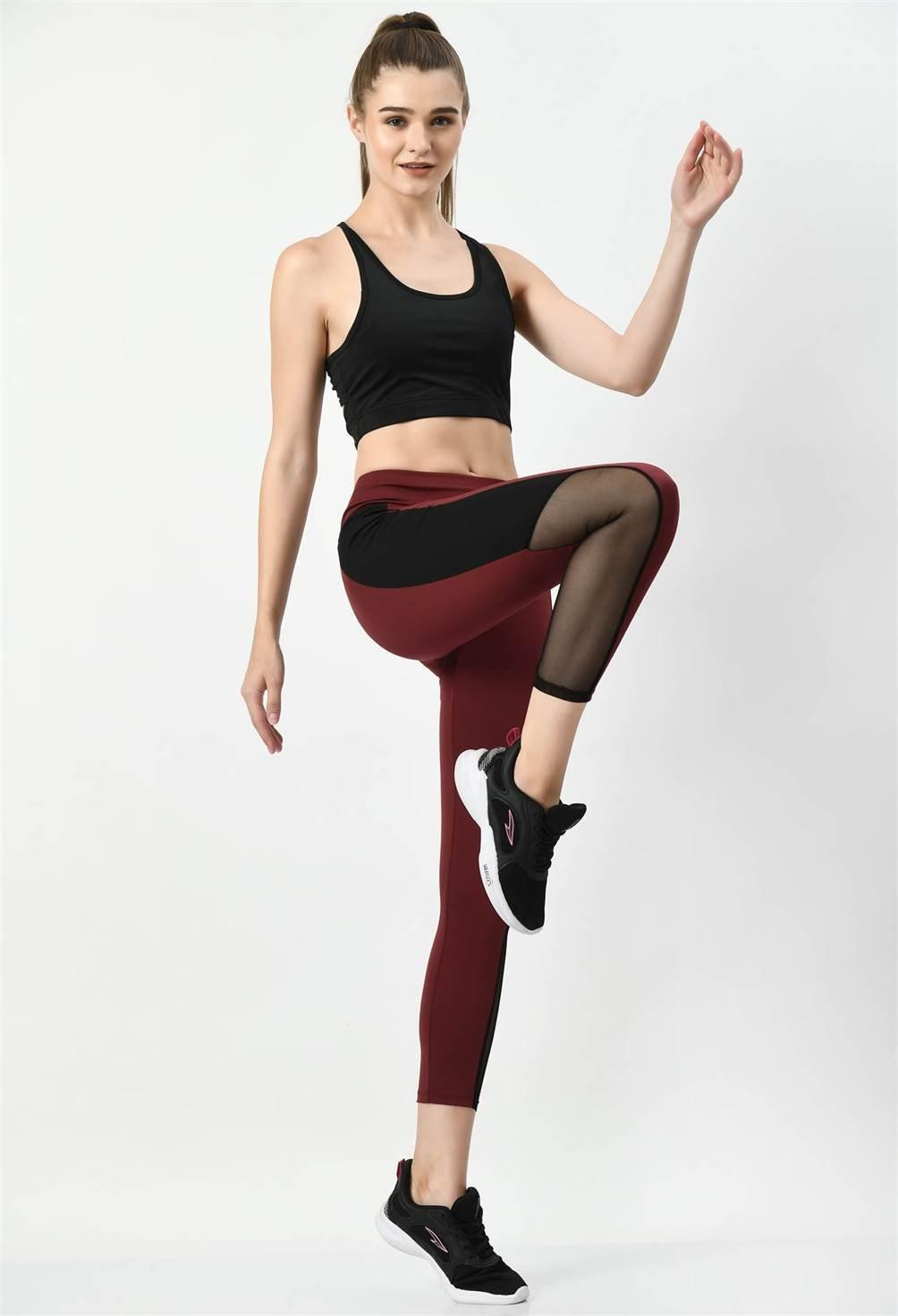 Waylene Sports Wear Color Block Wine Tights with model seated, highlighting comfort and style.