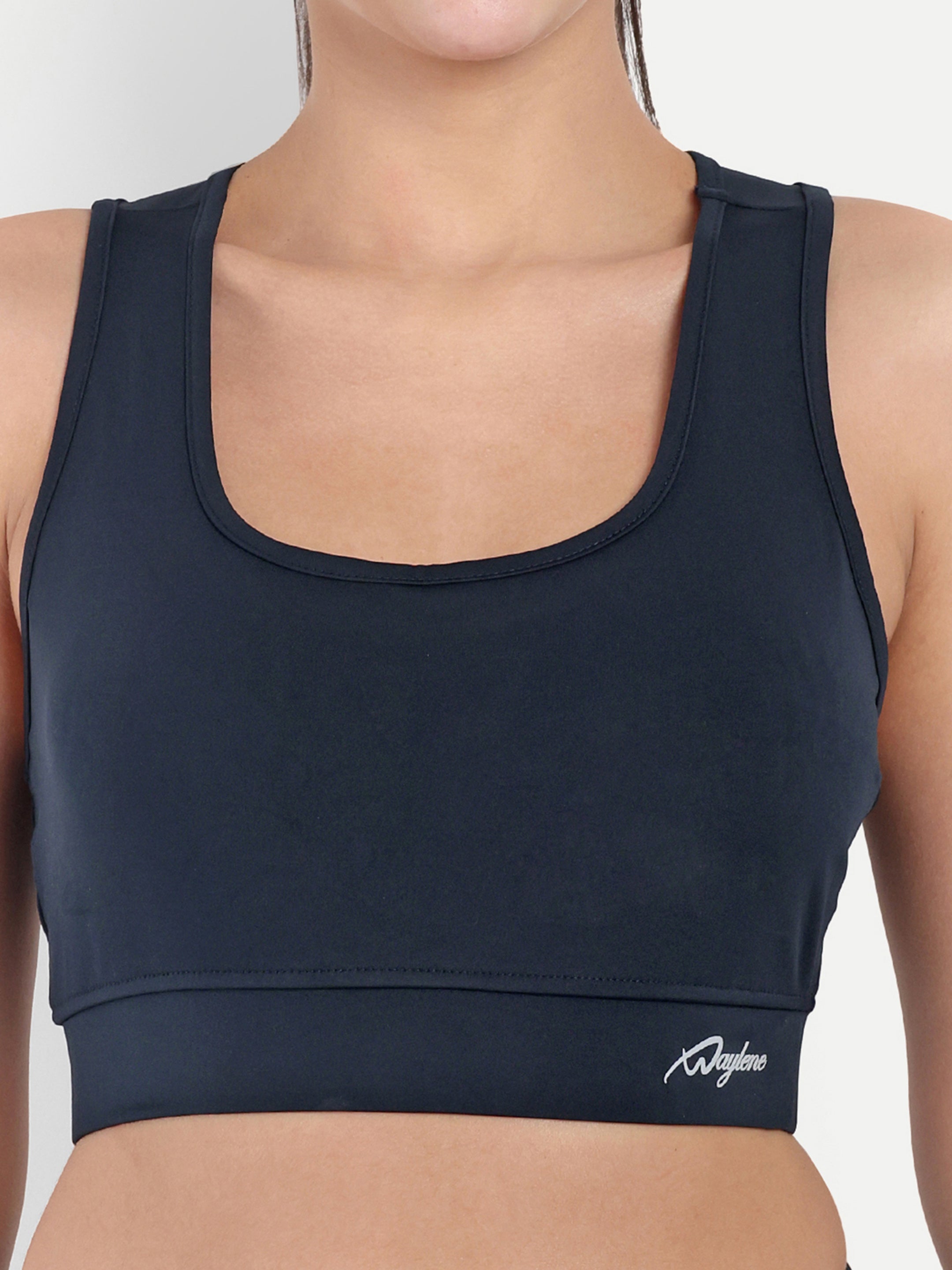ALT text: Close-up of Waylene's sports bra in navy blue, showing the fabric's texture and subtle logo detailing.