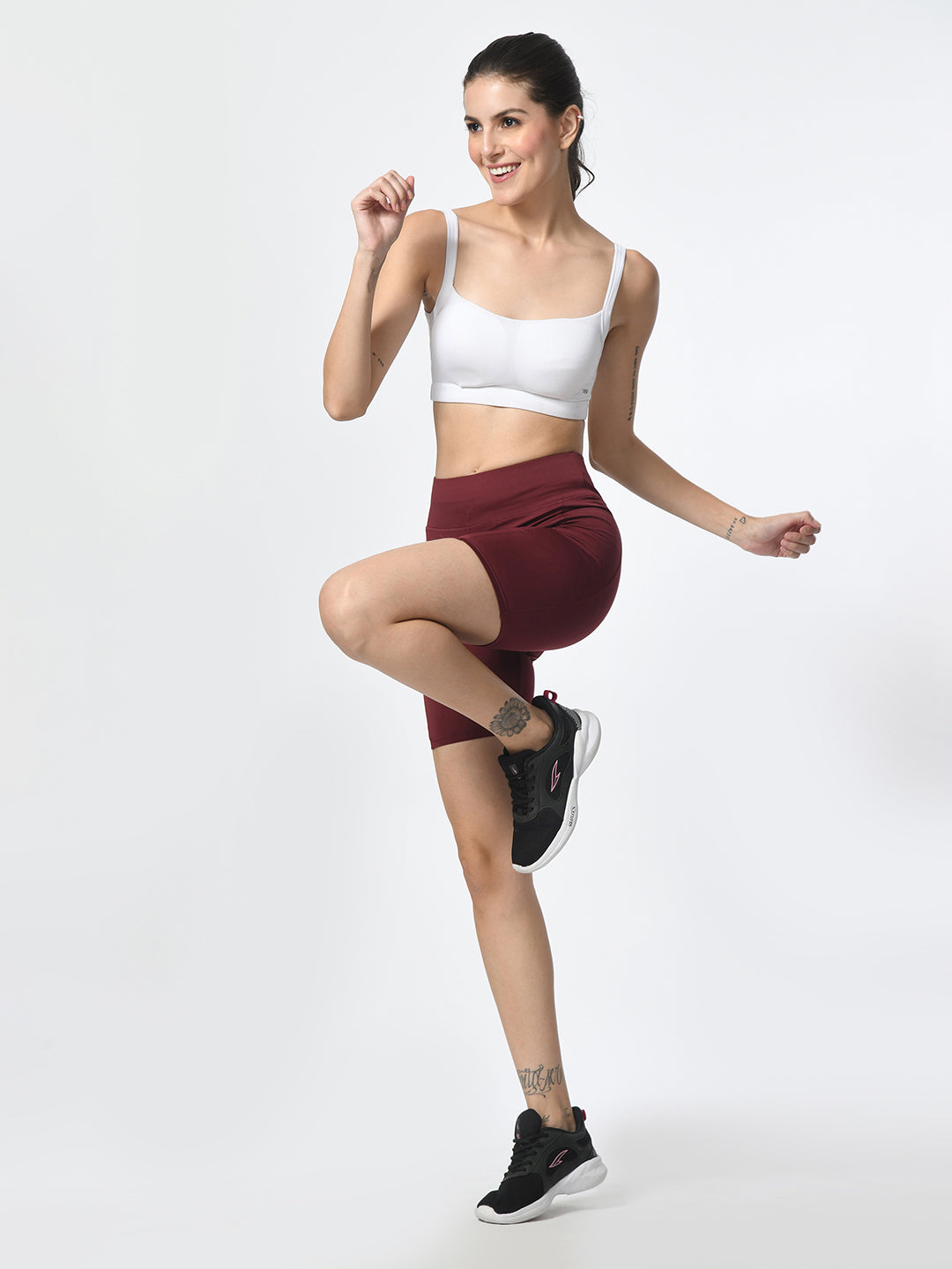 Woman training in Waylene wine-colored shorts