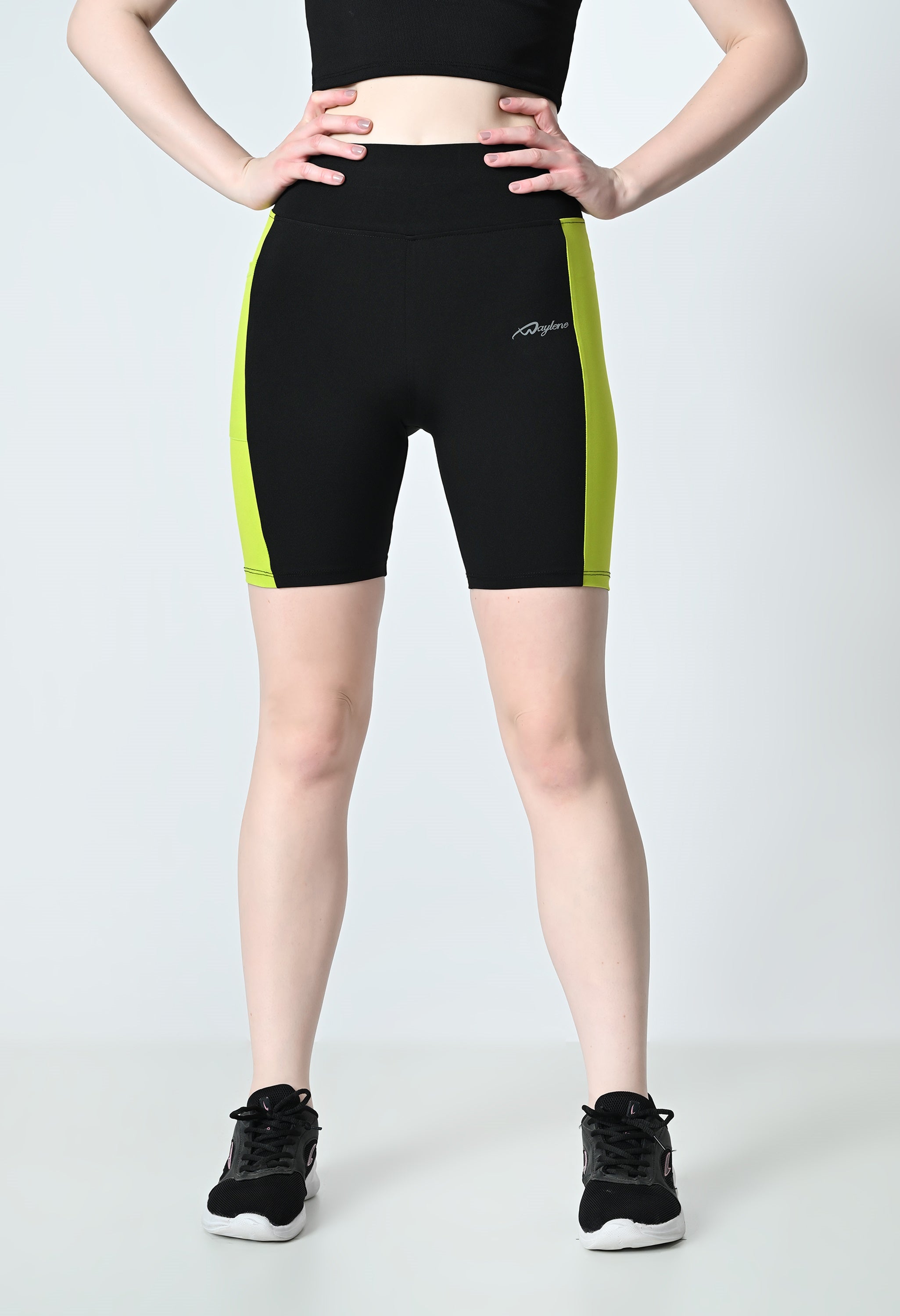 front close look of waylene's colour block gym shorts for women black and parrot green
