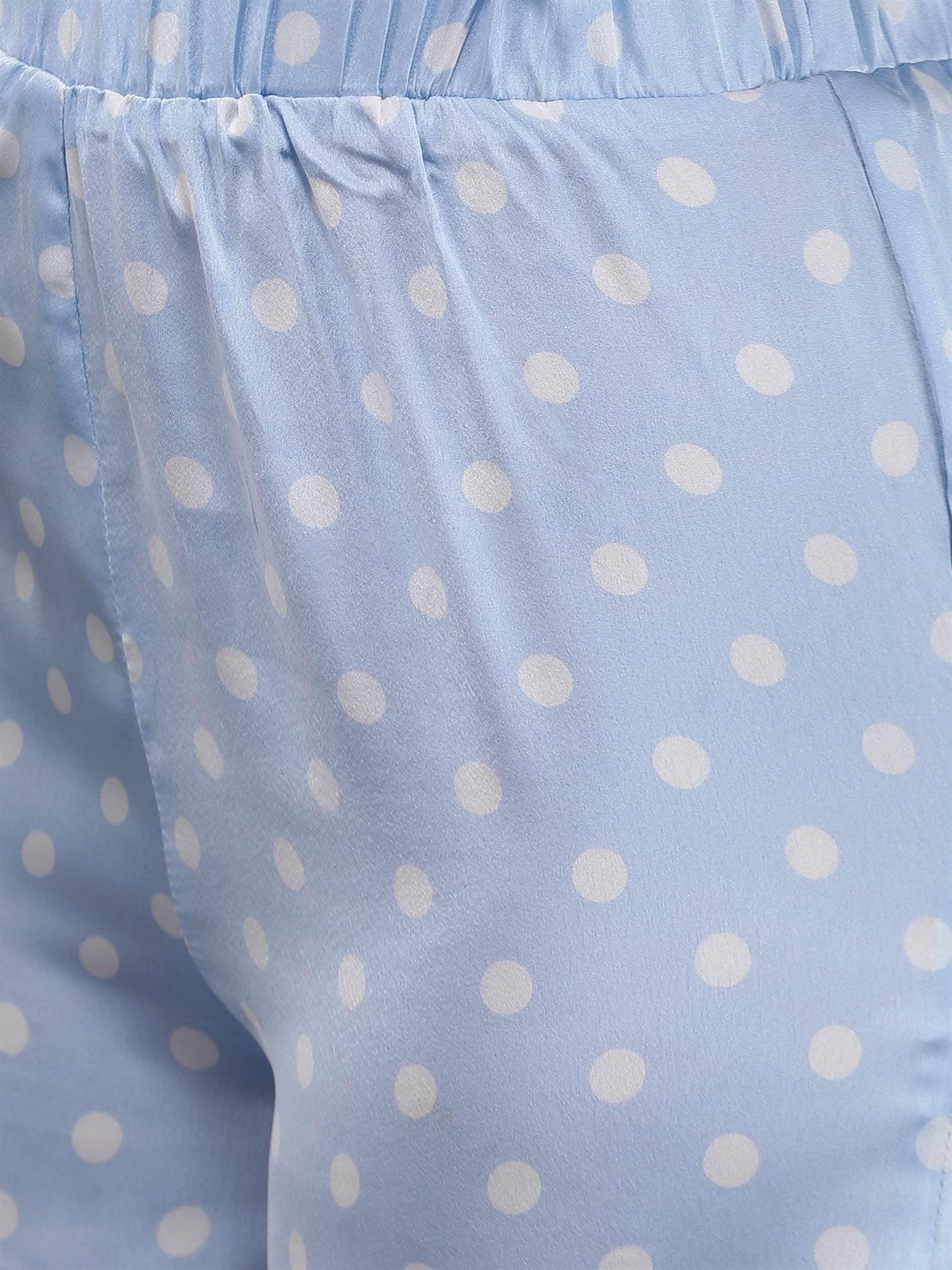 Zoomed-in texture shot of Waylene's light blue polka dot satin PJ set, displaying the soft satin fabric and vibrant polka dot pattern in detail.