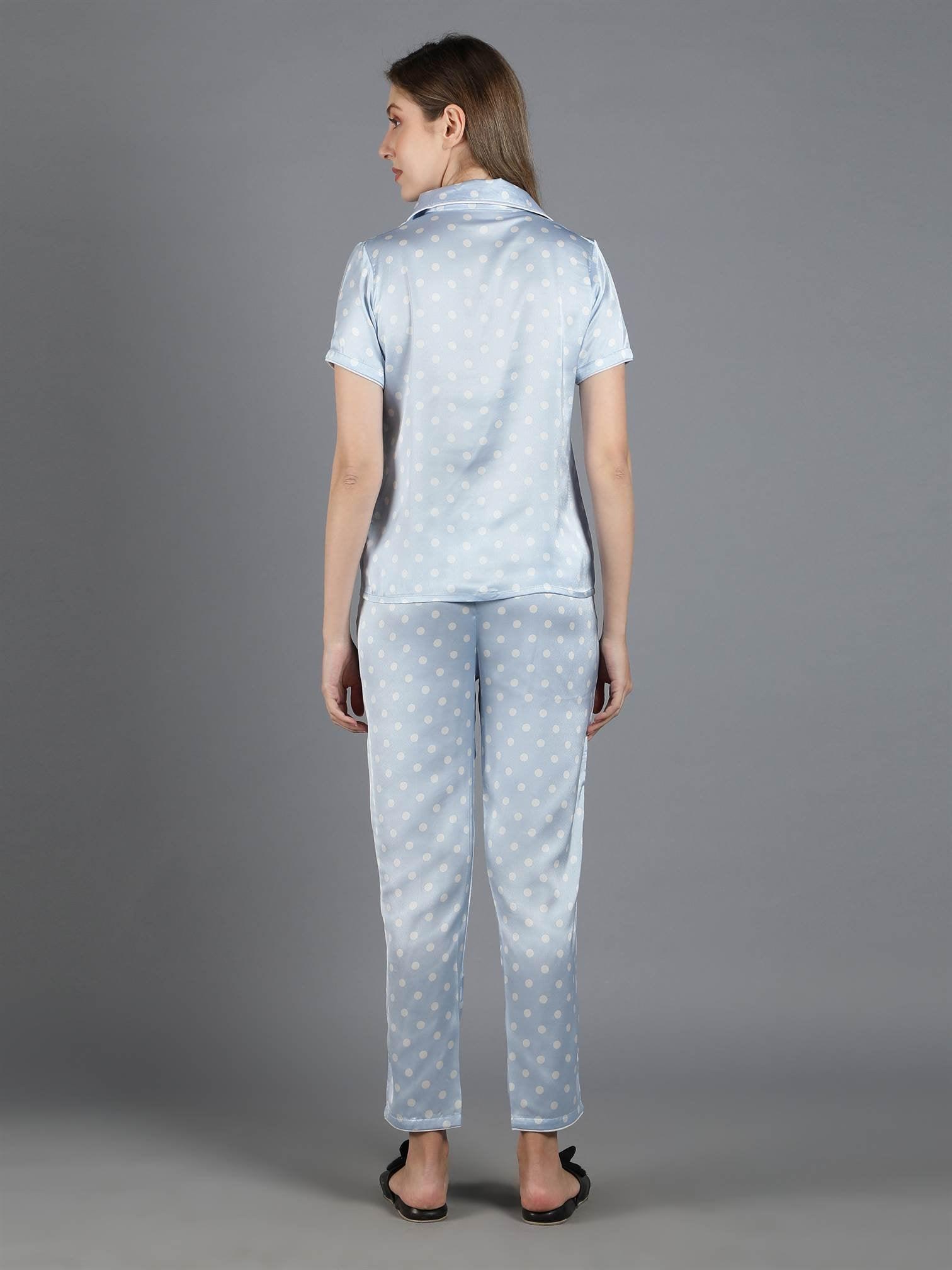 Rear view of a model wearing Waylene's light blue polka dot satin PJ set, showcasing the full coverage and comfortable fit of the pajamas.