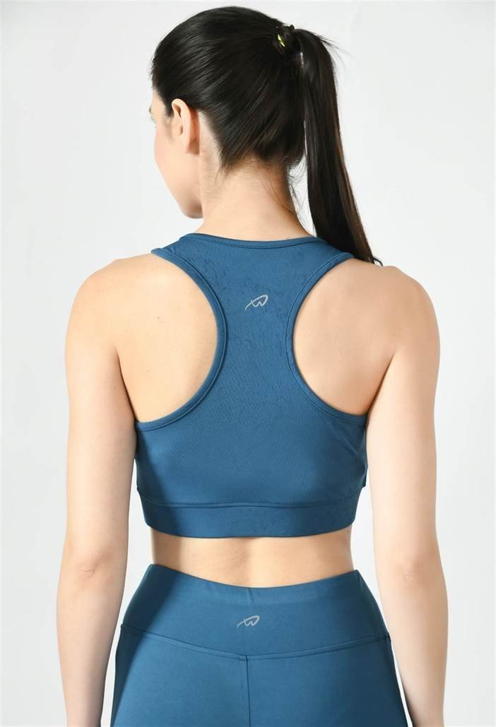 Close-up of Waylene light blue (teal) sports bra showing racerback design and stretchable straps - back view