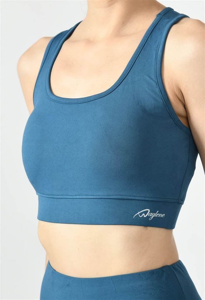 Close-up of Waylene light blue (teal) sports bra showing racerback design and stretchable straps - front view