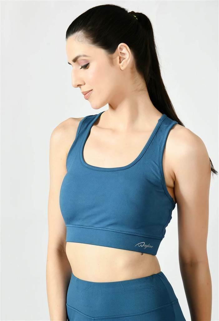 Model showcasing the comfortable fit of Waylene's light blue (teal) sports bra - side view