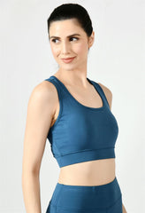 Model showcasing the comfortable fit of Waylene's light blue (teal) sports bra - side view 2