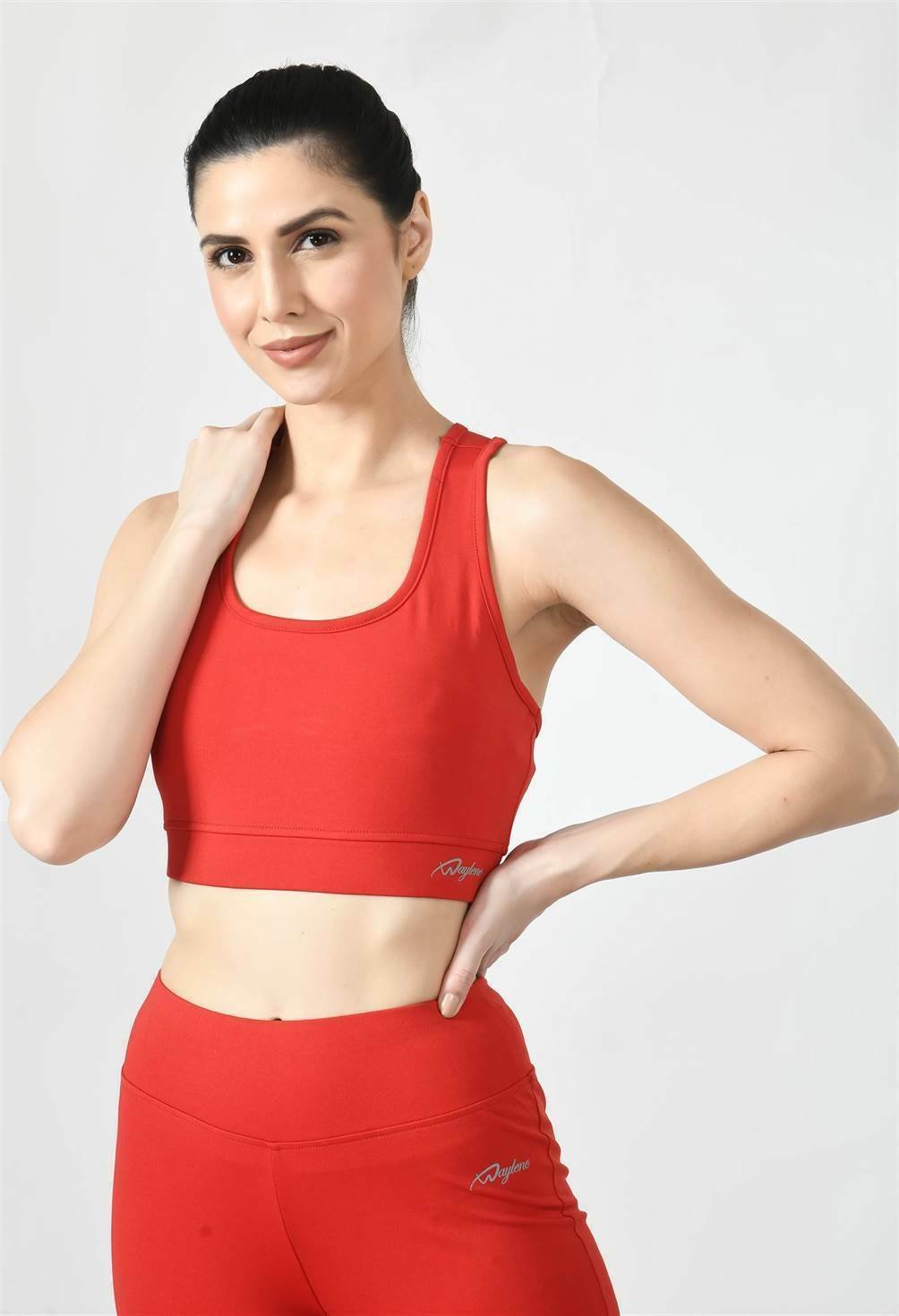 Model showcasing the comfortable fit of Waylene's red sports bra - front view