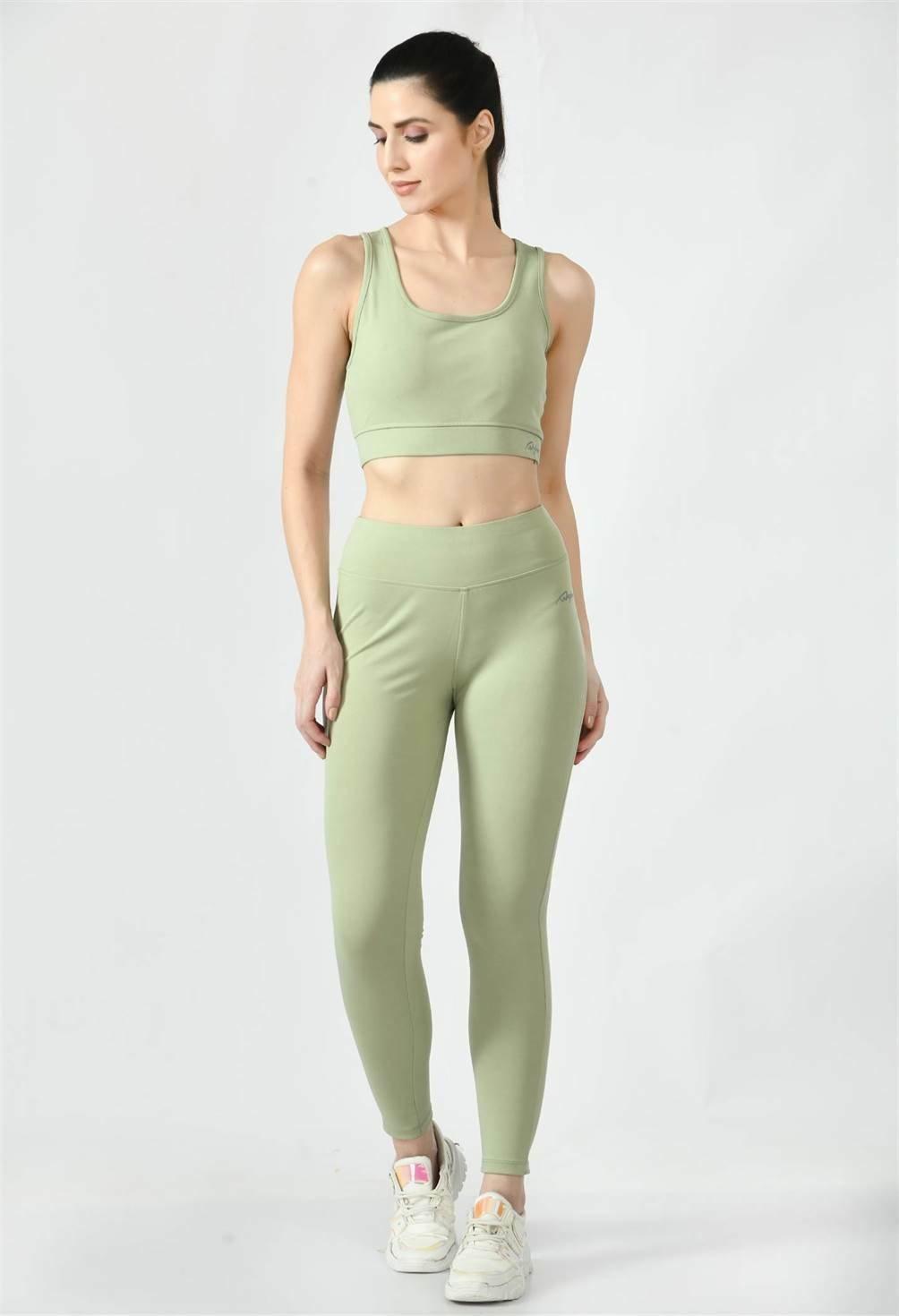 Model is wearing Waylene's  sports wear light green leggings & sports bra during a yoga session