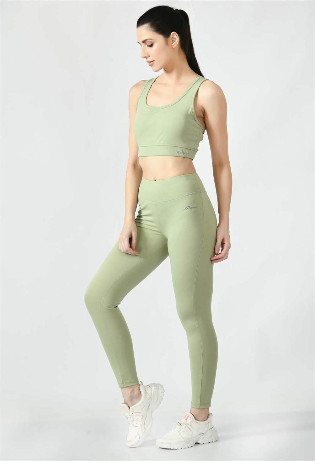 Model is wearing Waylene's  sports wear light green leggings & sports bra during a fitness session