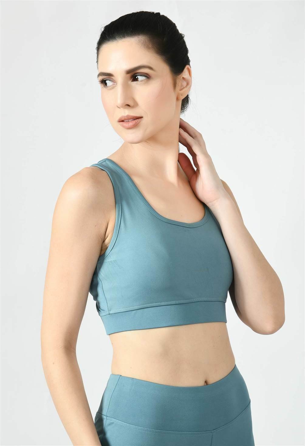 Model showcasing the comfortable fit of Waylene's light blue (Air Force Blue) sports bra - side view