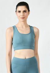 Model showcasing the comfortable fit of Waylene's light blue (Air Force Blue) sports bra - close view