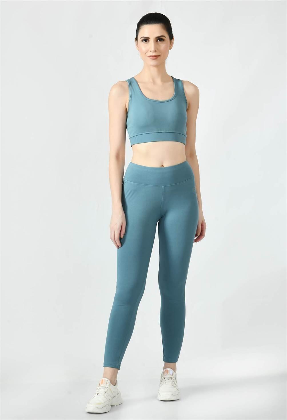 Woman after a workout session in Waylene's light blue (Air Force Blue) high-waisted yoga leggings.