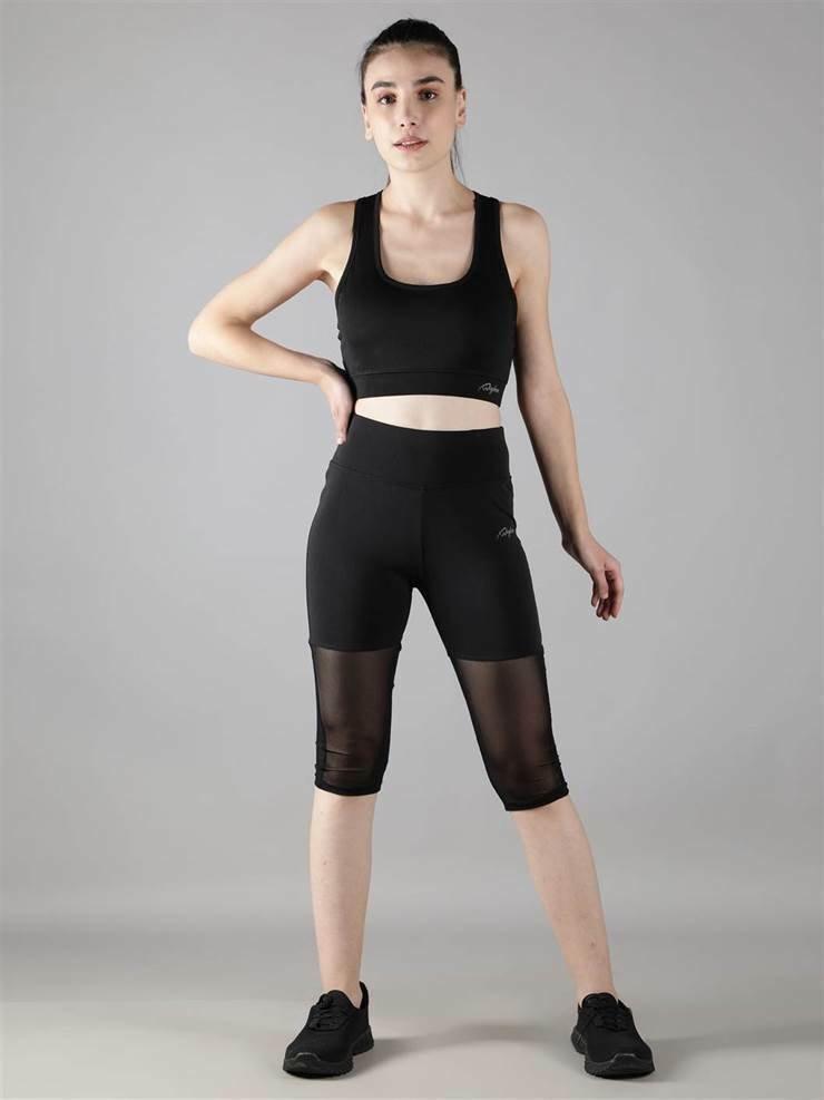 Women wearing gym & yoga wear Waylene black high-waisted capri leggings with rounded mesh panels and sports bra