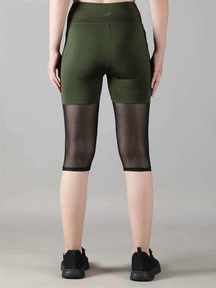 Woman practicing yoga in Waylene olive green high-waisted capri leggings with rounded mesh panels - back view