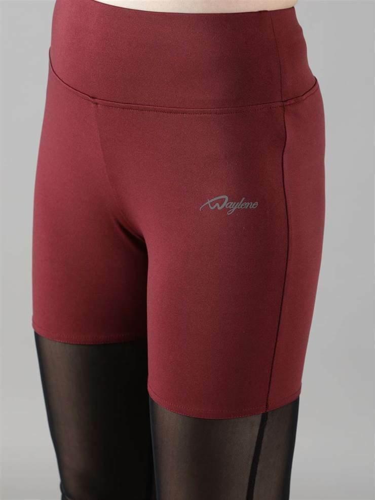 Woman wearing Waylene maroon (wine) high-waisted capri leggings with rounded mesh panels – fabric view