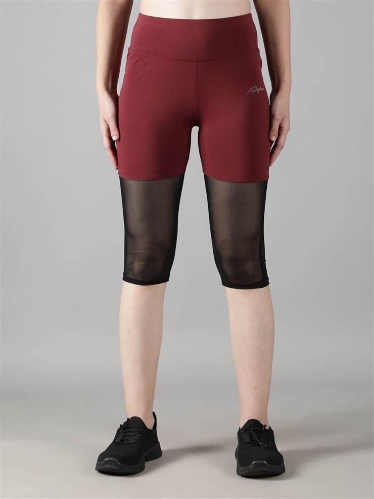 Woman wearing Waylene maroon (wine) high-waisted capri leggings with rounded mesh panels – front view