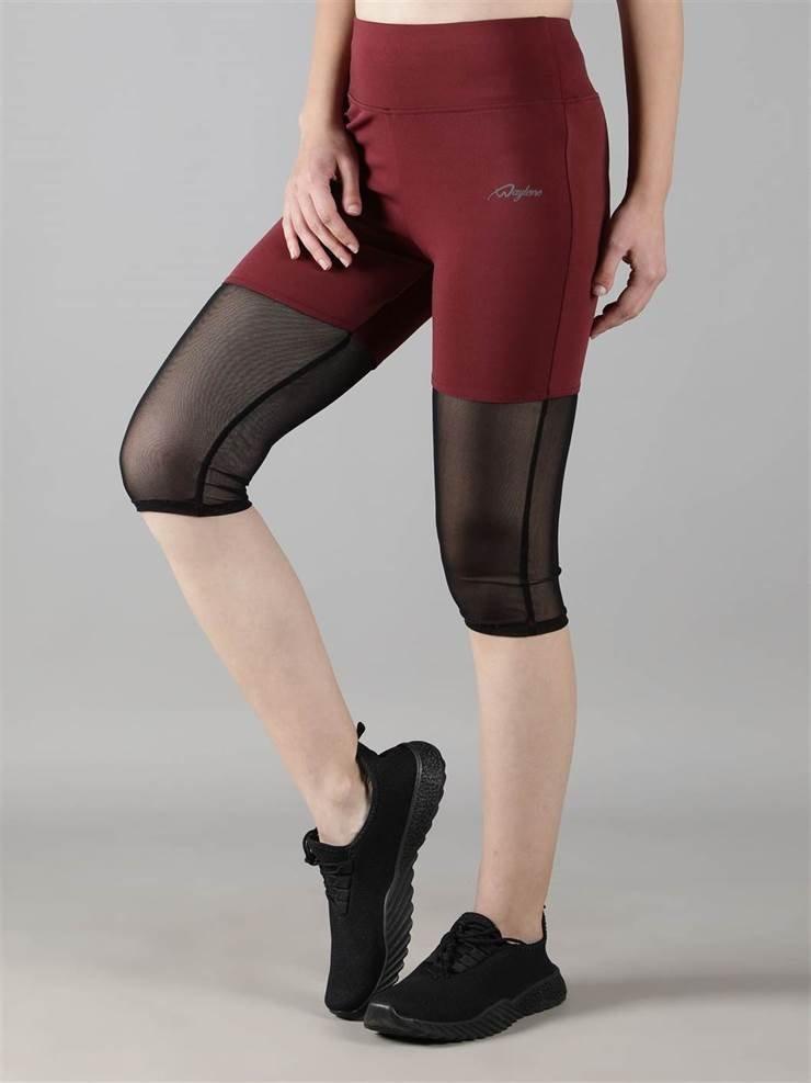 Woman wearing Waylene maroon (wine) high-waisted capri leggings with rounded mesh panels – side view