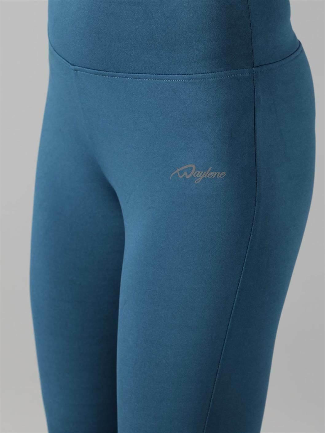 Woman practicing yoga in Waylene teal high-waisted plain sports capris close view