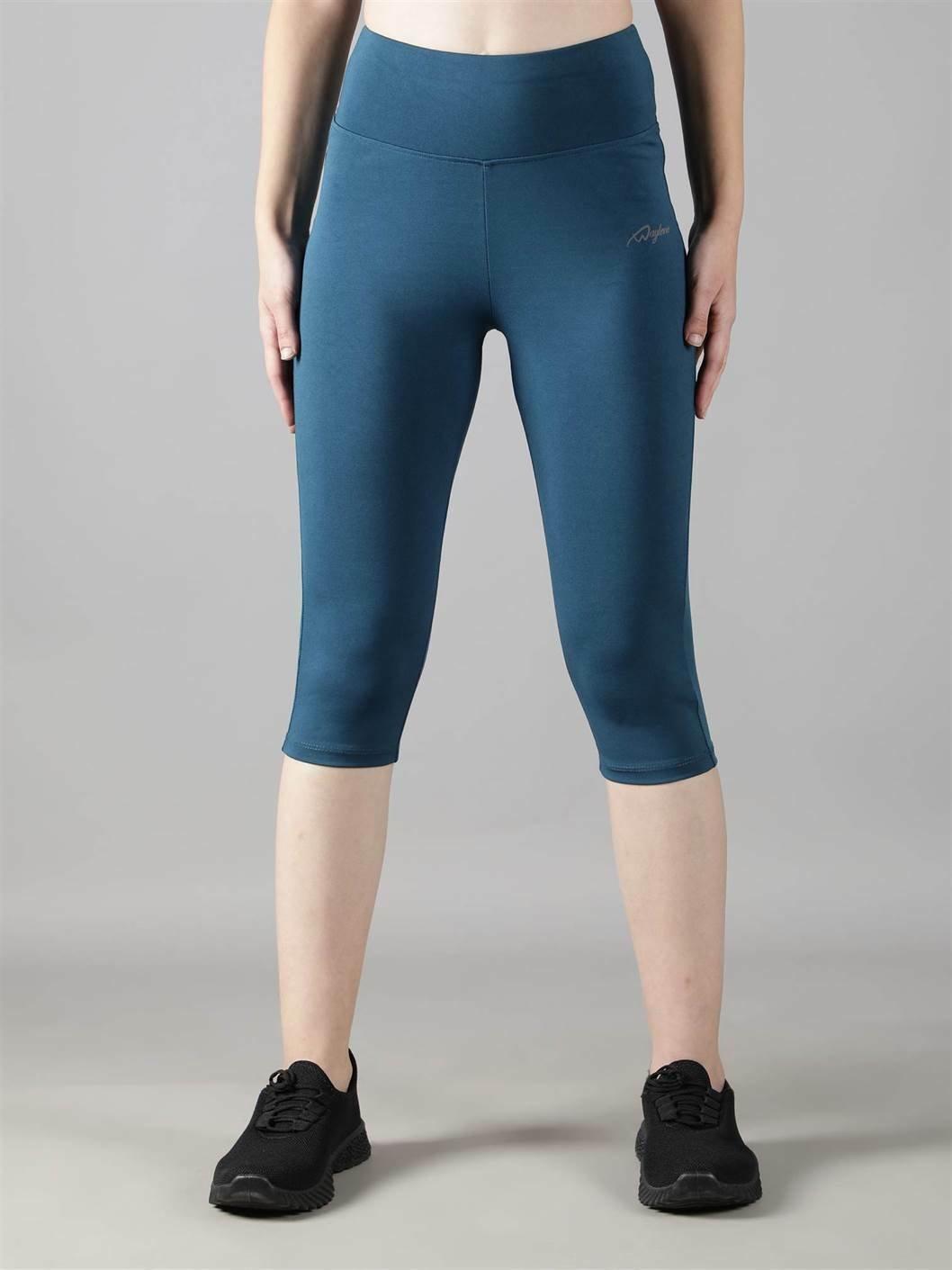 Woman practicing yoga in Waylene teal high-waisted plain sports capris - front view